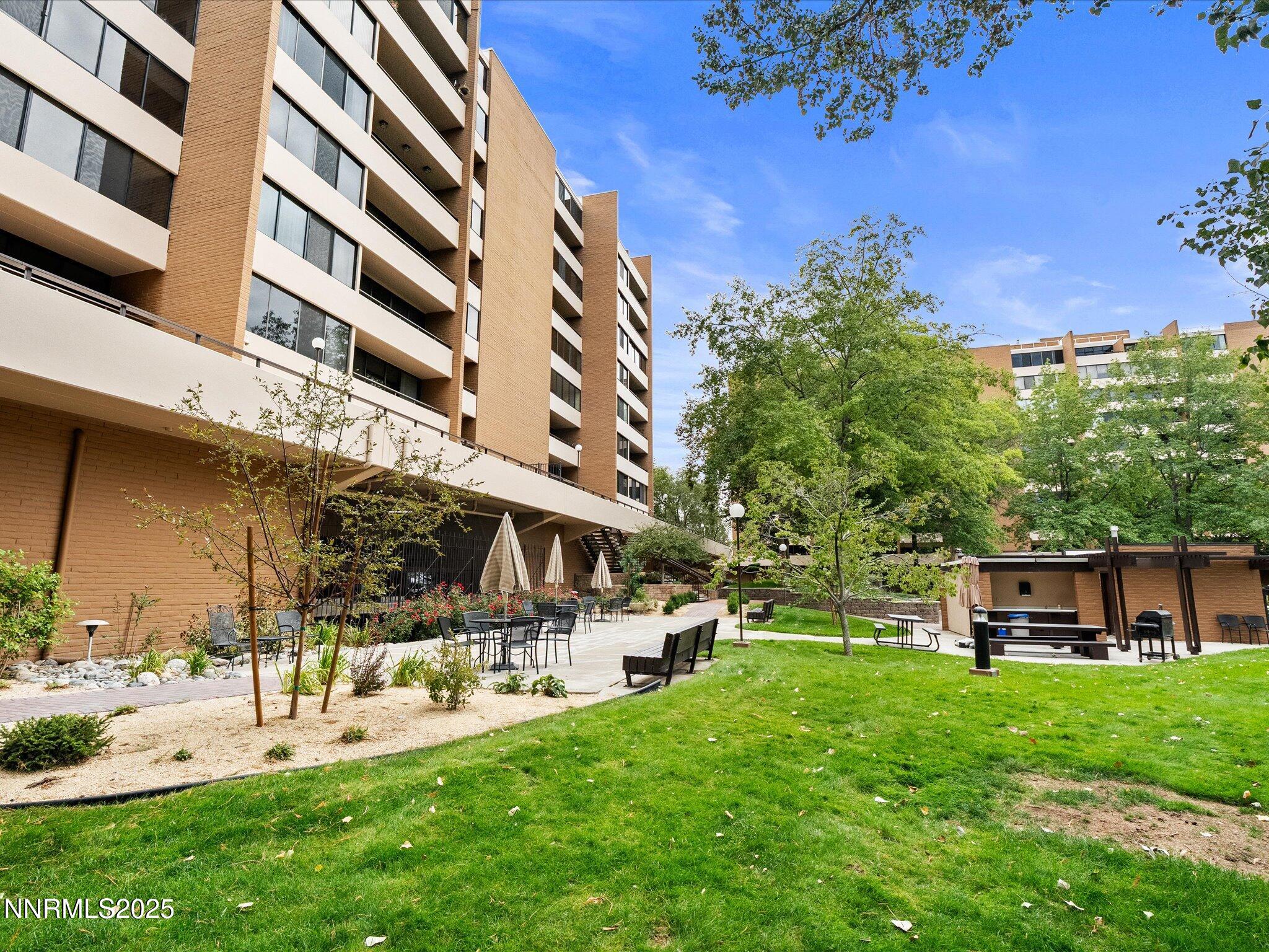 1200 Riverside Drive, Unit 1276 Reno, NV 89503 - Photo 44 of 47 a view of a building with a yard