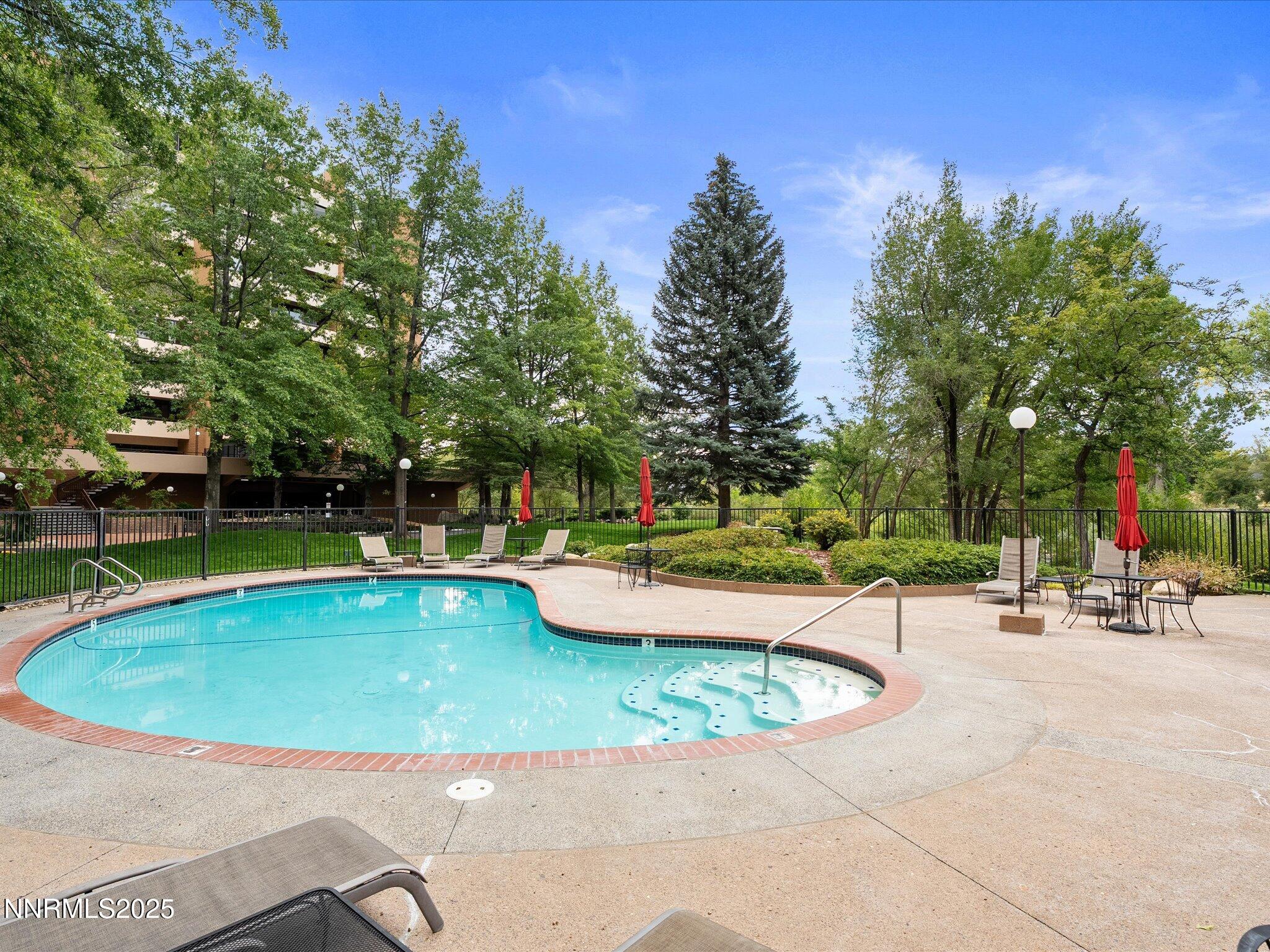 1200 Riverside Drive, Unit 1276 Reno, NV 89503 - Photo 7 of 47 a view of a swimming pool with a patio