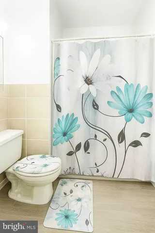 a living room with furniture and stairs