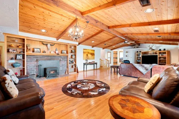 a view of a livingroom with furniture and a fireplace