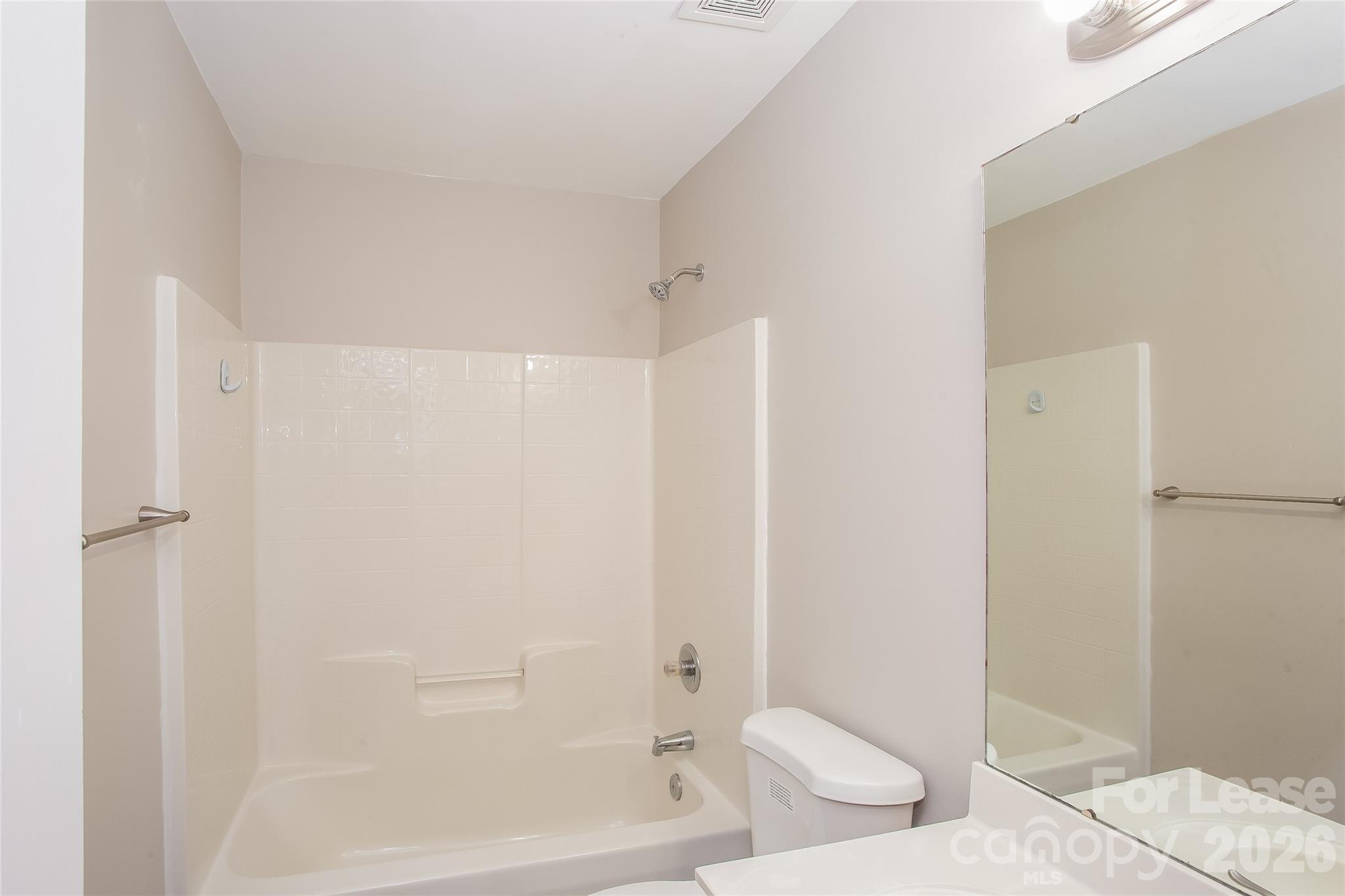 4262 Barley Street Southwest Concord, NC 28027 - Photo 13 of 15 a bathroom with a toilet and shower