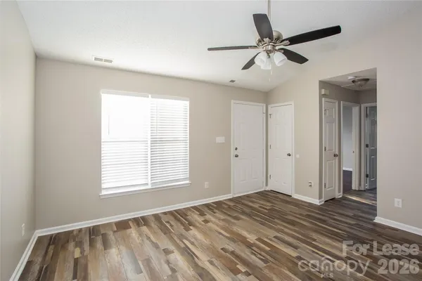 a view of room window and wooden floor
