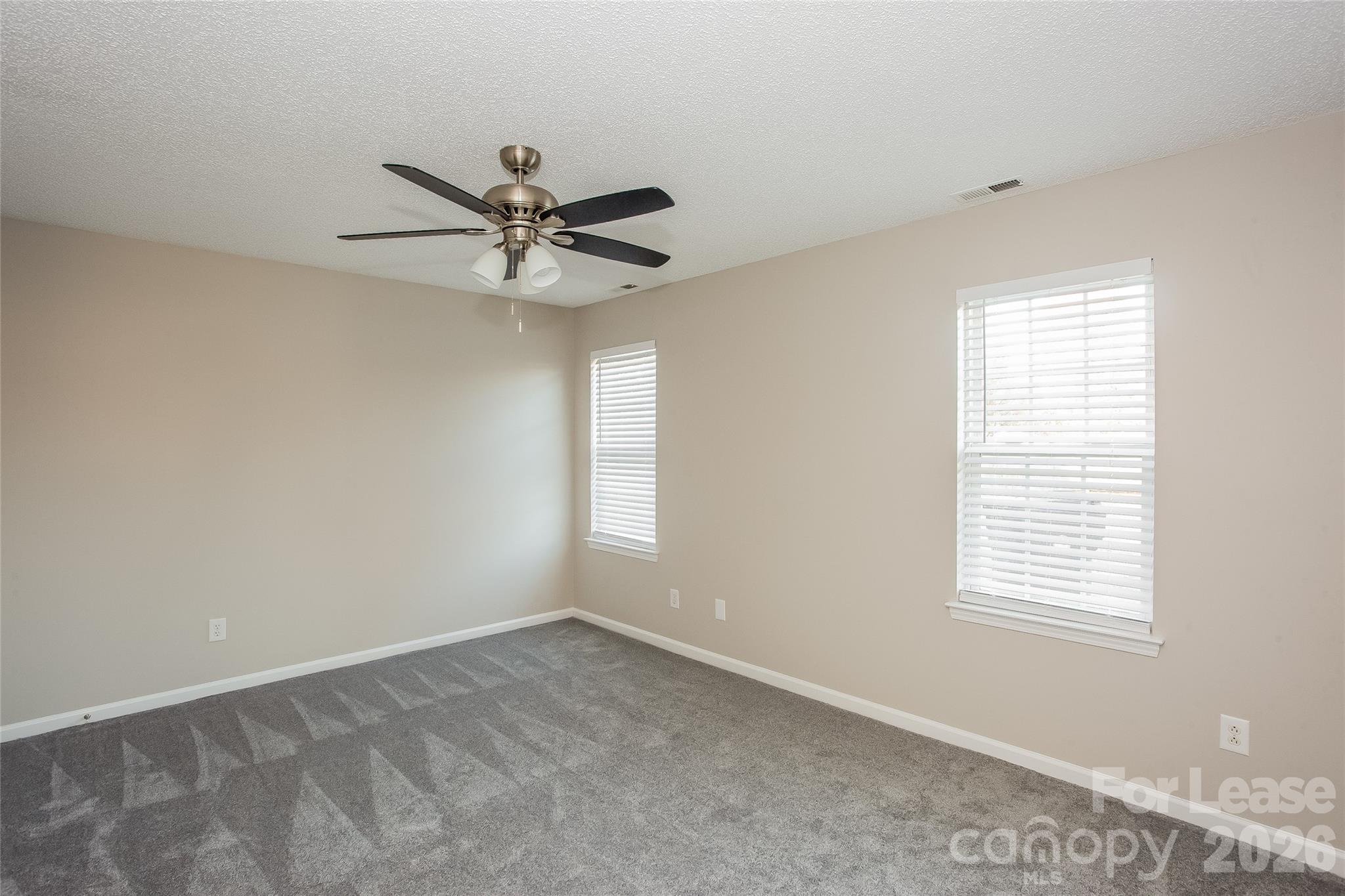 4262 Barley Street Southwest Concord, NC 28027 - Photo 8 of 15 a view of a workspace with a window and a ceiling fan