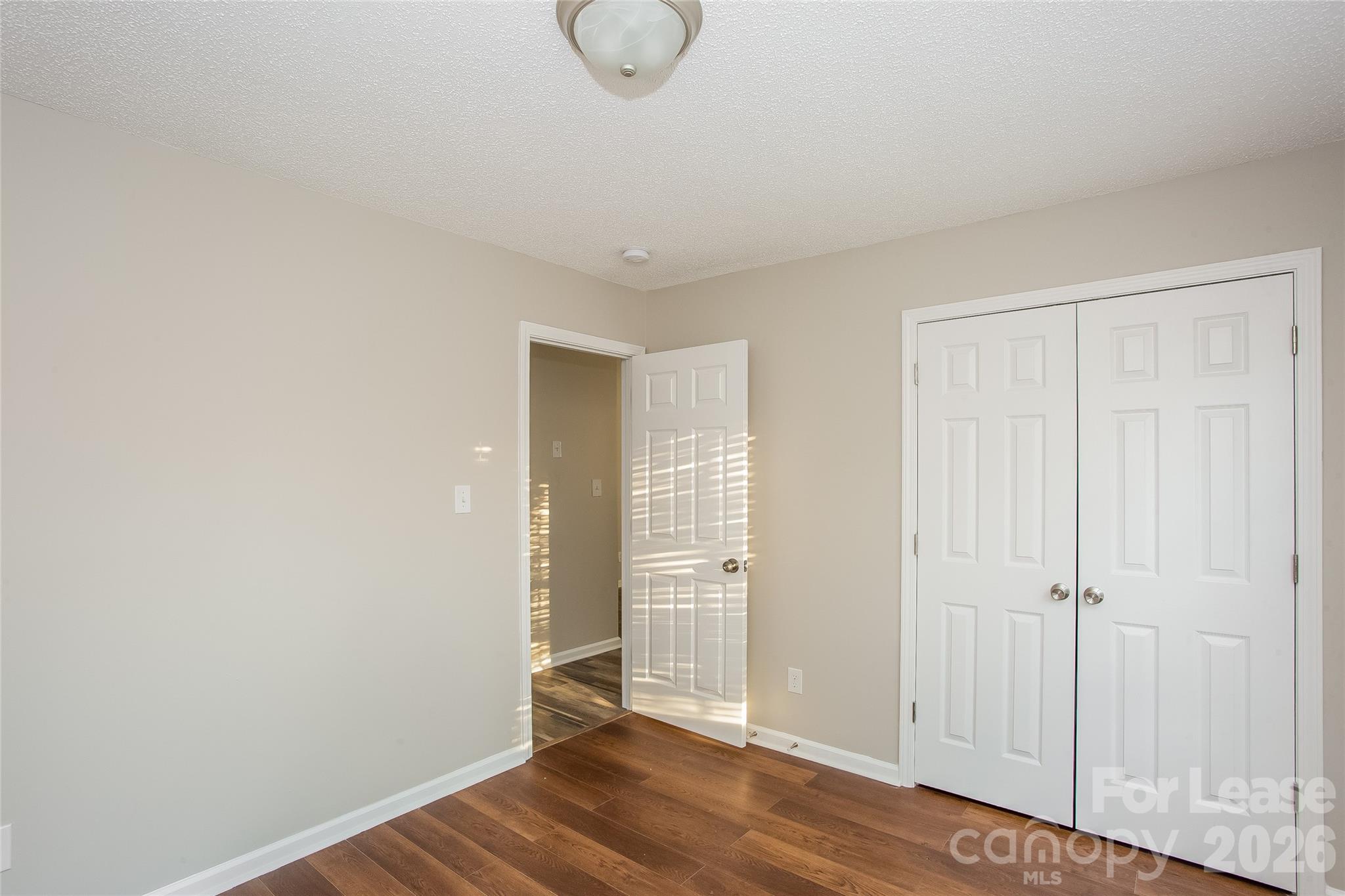 4262 Barley Street Southwest Concord, NC 28027 - Photo 9 of 15 a view of a room with wooden floor