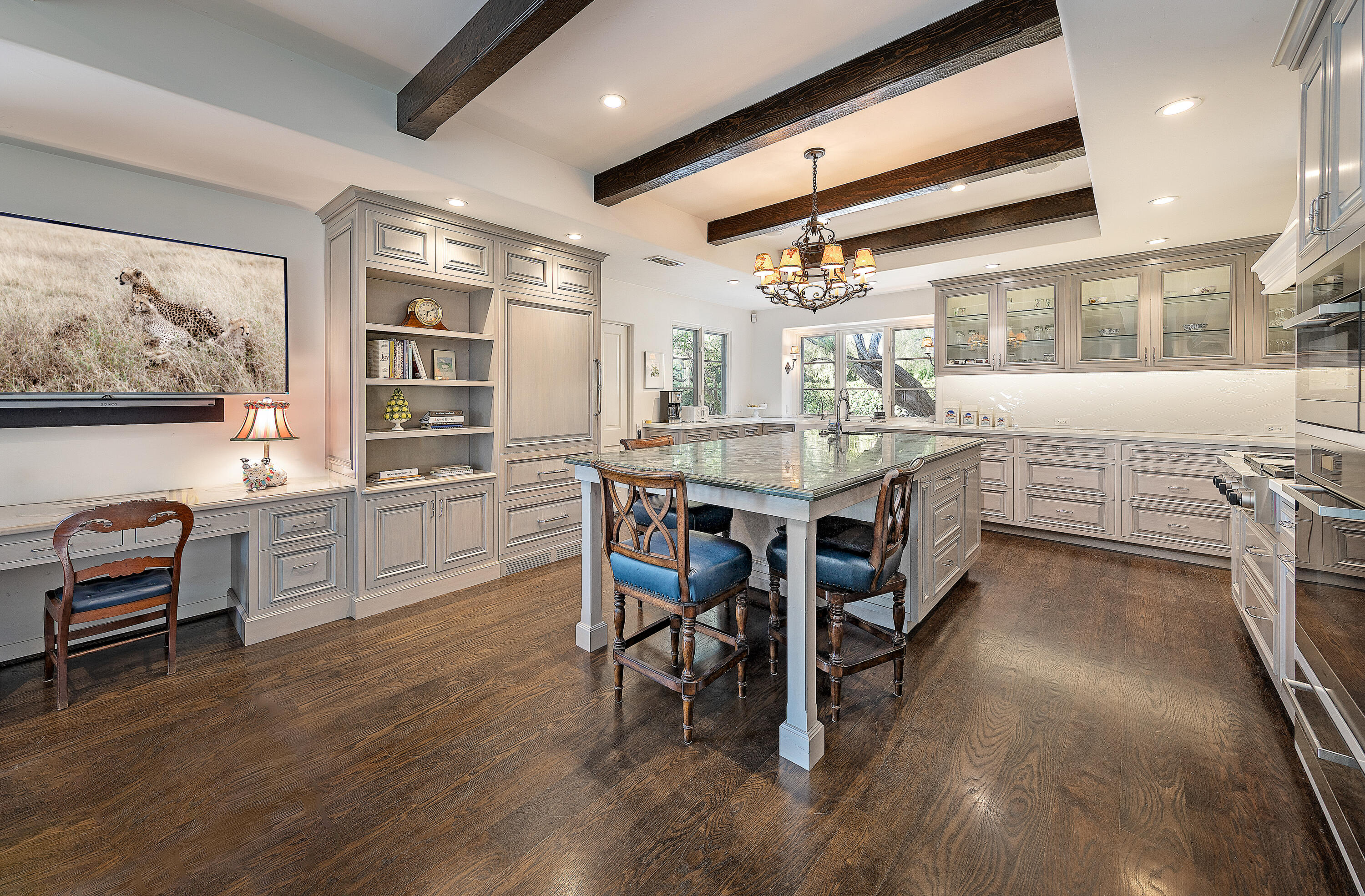 1029 Alston Road Montecito, CA 93108 - Photo 6 of 24 a large white kitchen with a large window and stainless steel appliances