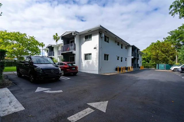 a view of a car park in front of house