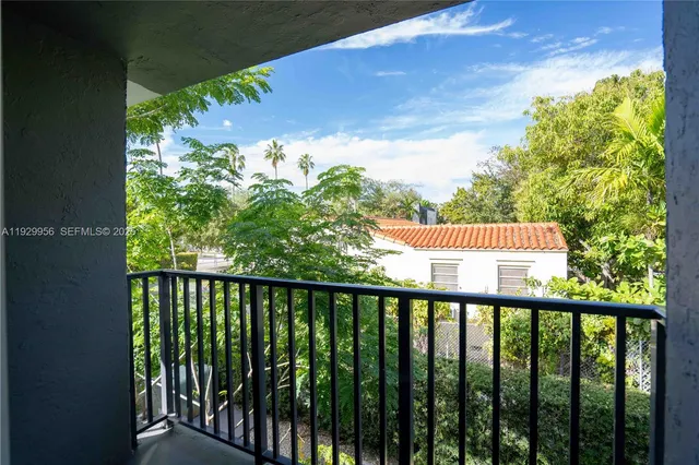 a view of a balcony with a pot