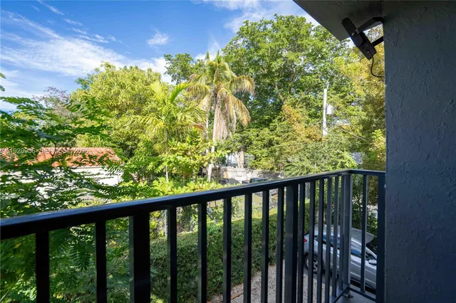 a view of a balcony with a plant
