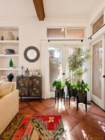 a dining room with furniture and a chandelier