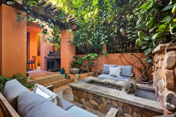 a bedroom with a bed and glass door