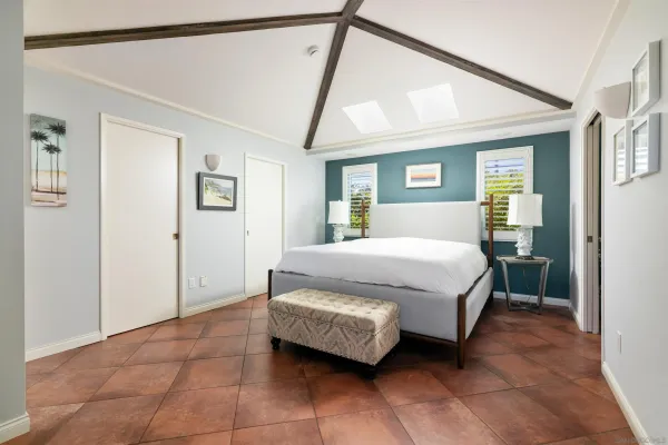 a bedroom with a bed and a walk in closet