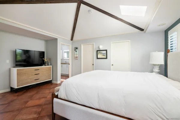 a balcony view with a large window and wooden floor