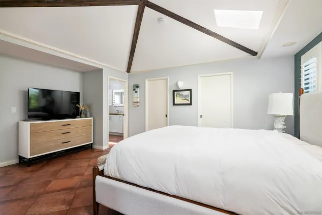a balcony view with a large window and wooden floor