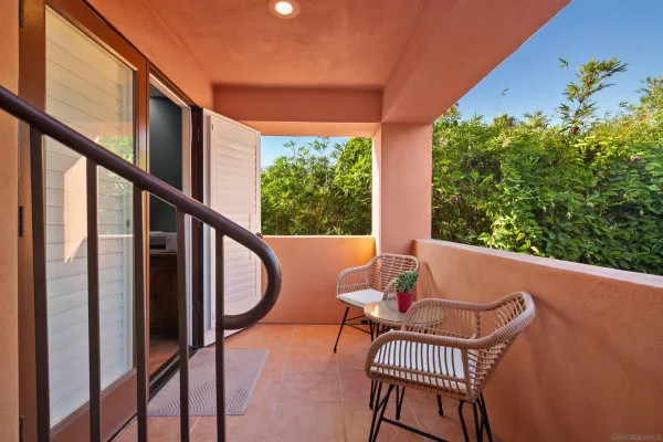 a bedroom with furniture and a flat screen tv