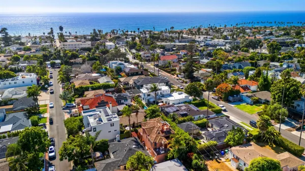 an aerial view of a city with lots of residential buildings