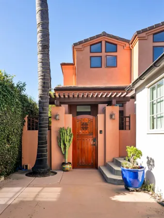 a living room with furniture large window and a fireplace