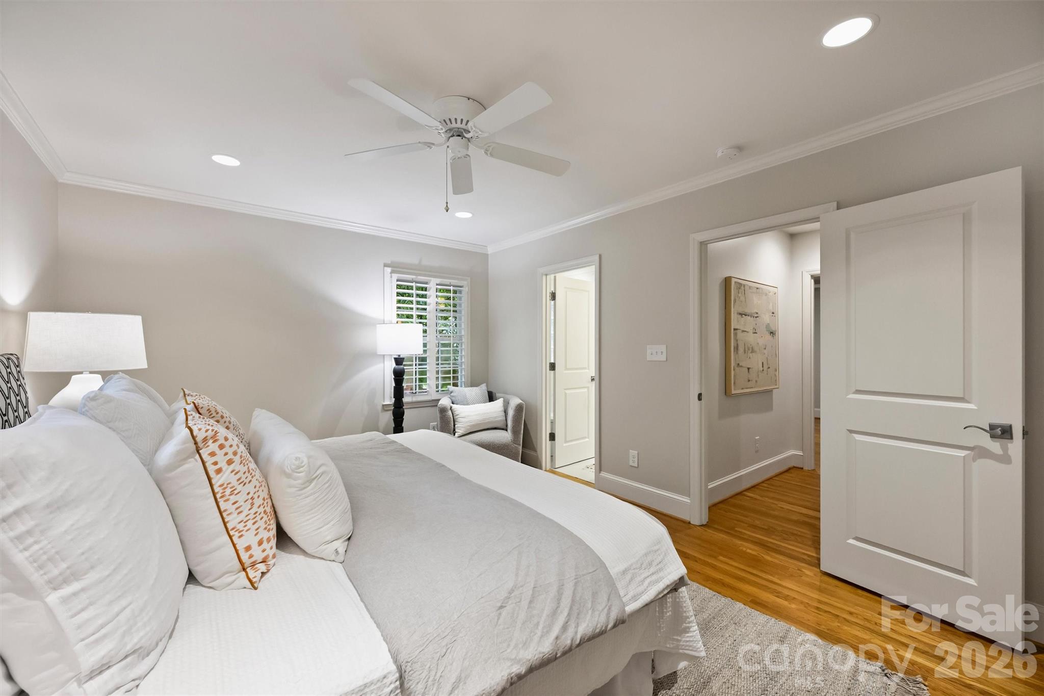 5519 Robinhood Road Charlotte, NC 28211 - Photo 31 of 46 a bedroom with a bed and a chandelier