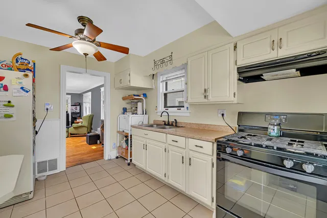 a kitchen with stainless steel appliances granite countertop a sink and cabinets