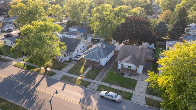an aerial view of residential houses with outdoor space