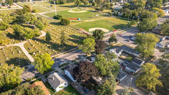 an aerial view of residential houses with outdoor space