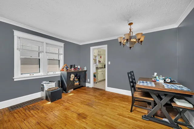 a work room with furniture and wooden floor