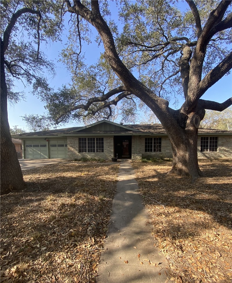 1119 Jefferson Street Alice, TX 78332 - Photo 1 of 23 a front view of a house with a yard