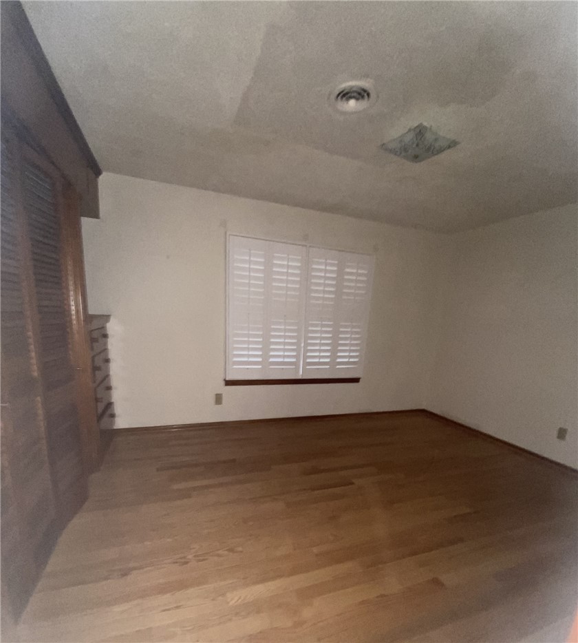 1119 Jefferson Street Alice, TX 78332 - Photo 11 of 23 a view of an empty room with a window