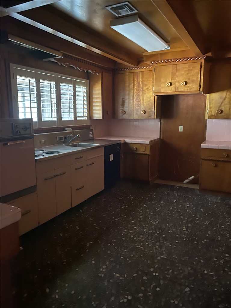 1119 Jefferson Street Alice, TX 78332 - Photo 7 of 23 a kitchen with sink and window