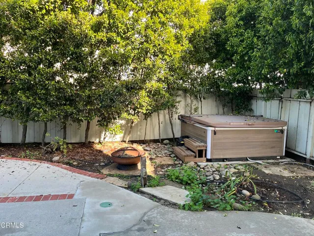 a view of a backyard with a patio