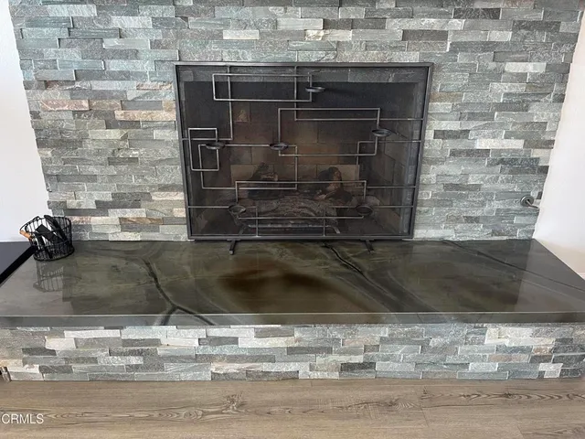 a kitchen with stainless steel appliances a stove a refrigerator and a oven