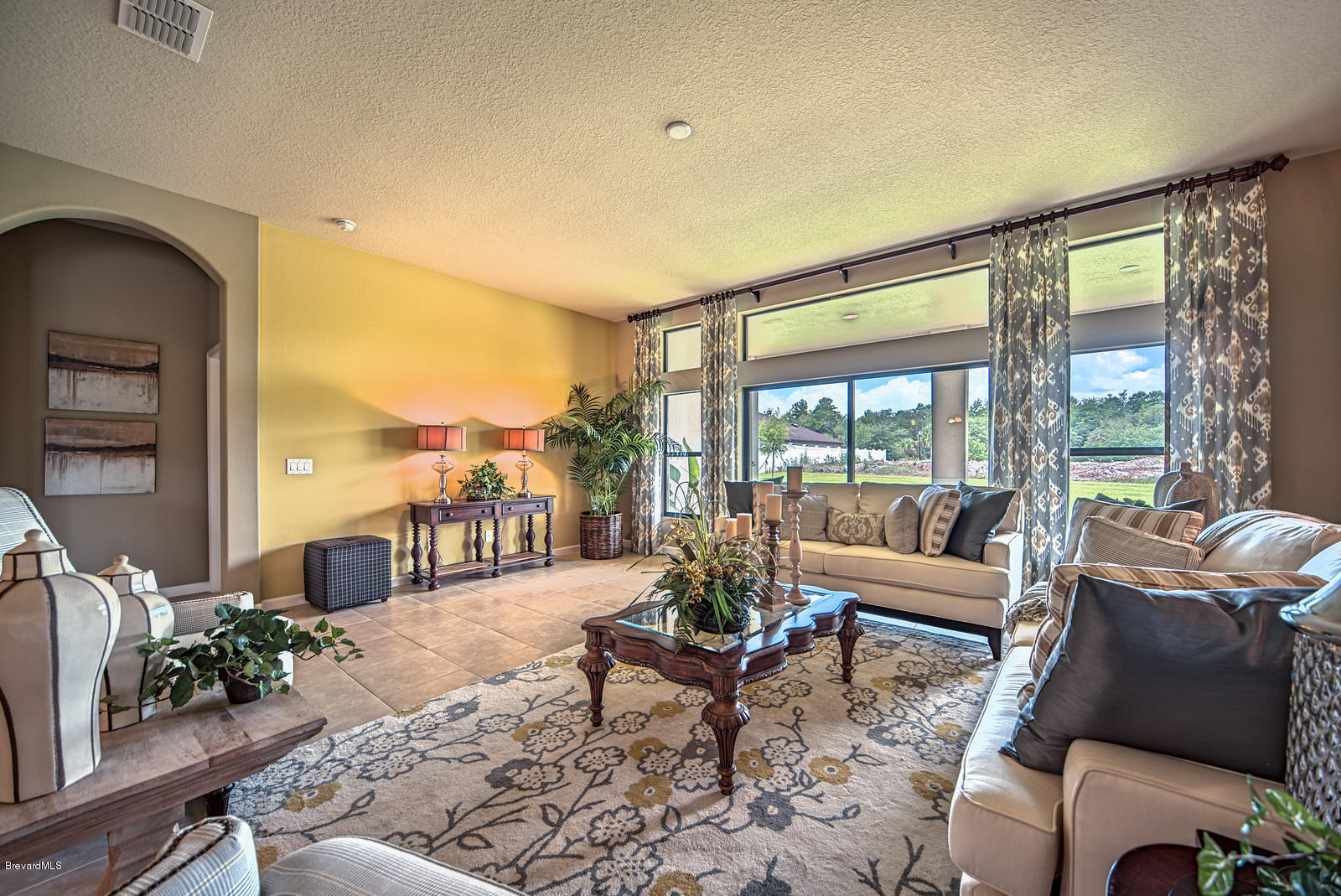 4082 Ruthann Circle Melbourne, FL 32934 - Photo 5 of 13 a living room with furniture and a large window