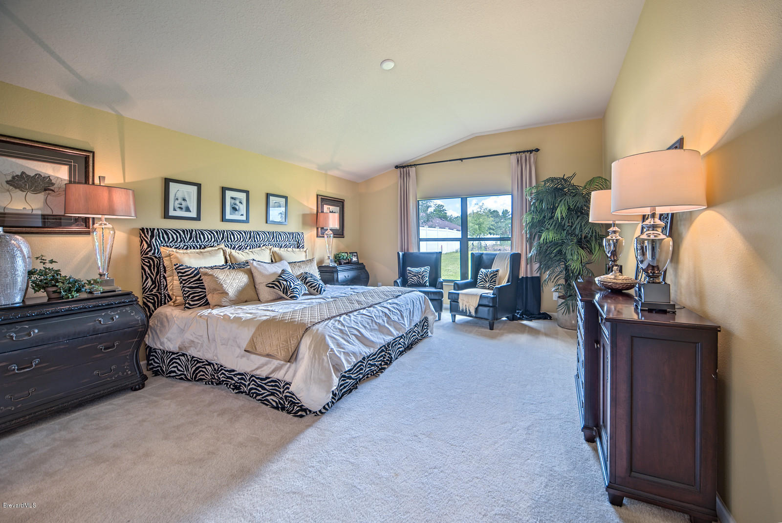 4082 Ruthann Circle Melbourne, FL 32934 - Photo 10 of 13 a spacious bedroom with a bed and window