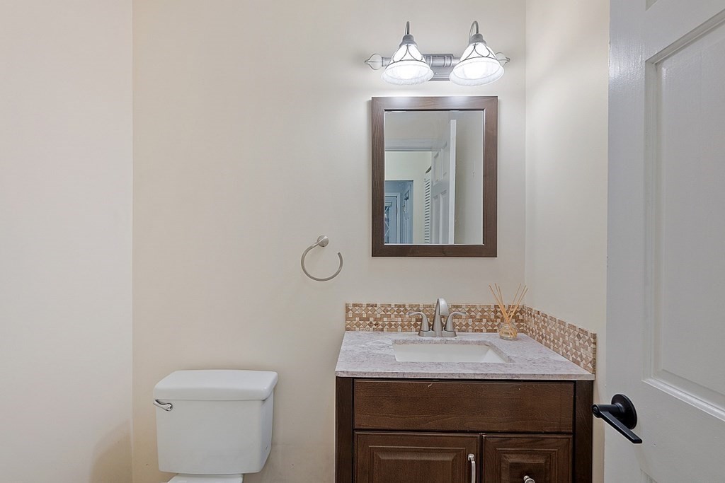 176 Southville Road Southborough, MA 01772 - Photo 13 of 39 a bathroom with a granite countertop sink and a mirror