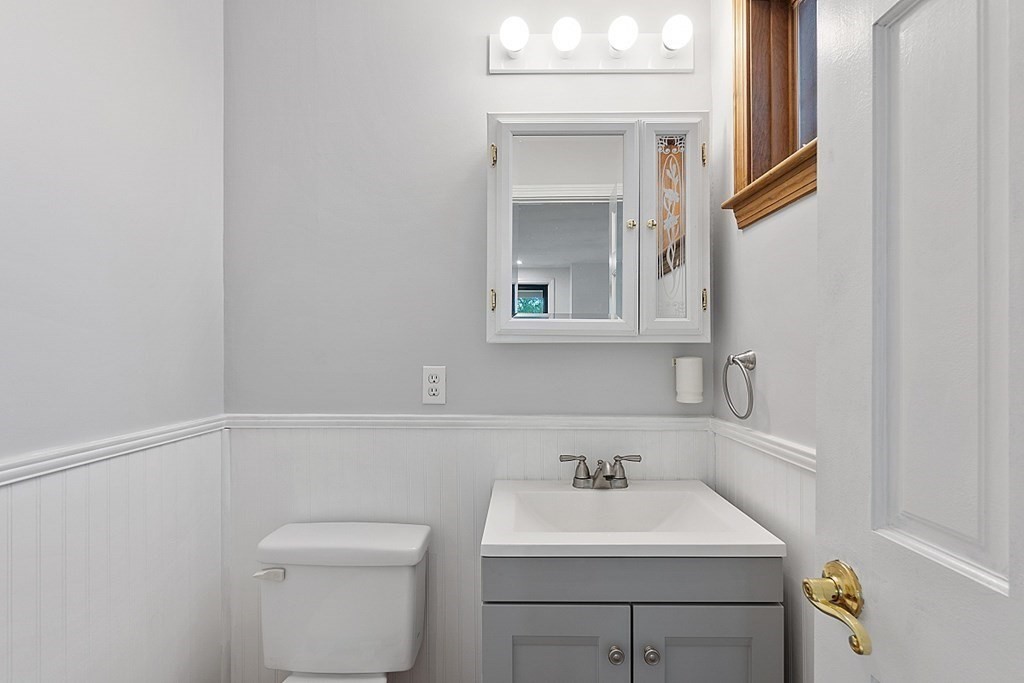 176 Southville Road Southborough, MA 01772 - Photo 20 of 39 a bathroom with a toilet sink and mirror