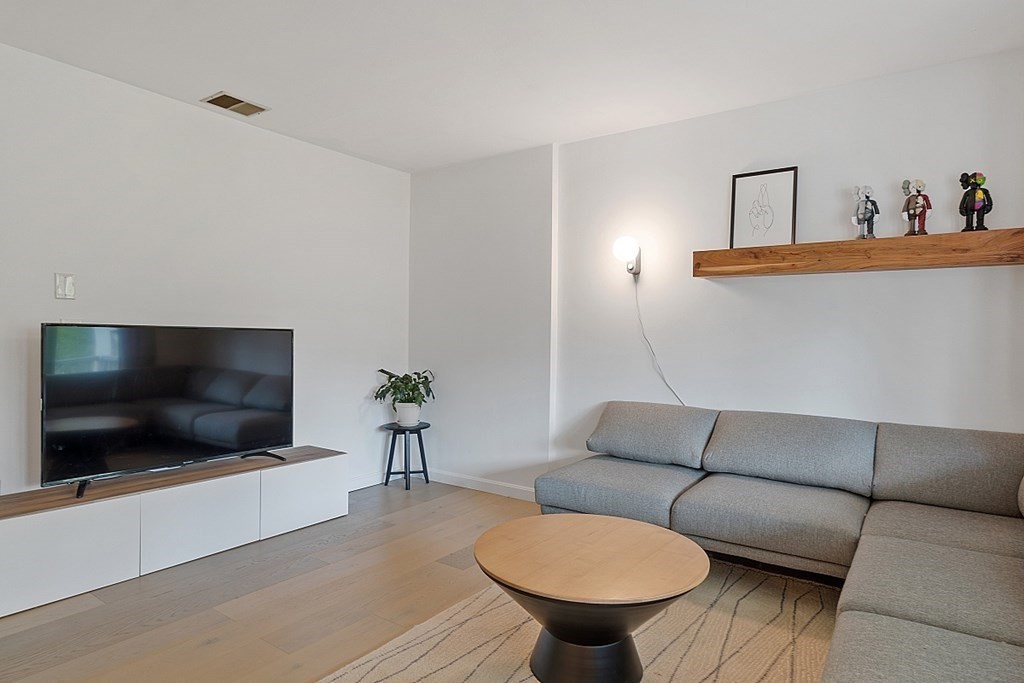 176 Southville Road Southborough, MA 01772 - Photo 3 of 39 a living room with furniture and a flat screen tv