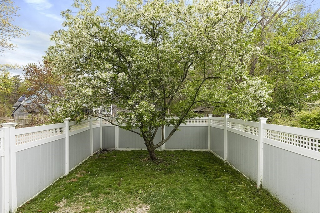 176 Southville Road Southborough, MA 01772 - Photo 32 of 39 a backyard of a house with lots of green space