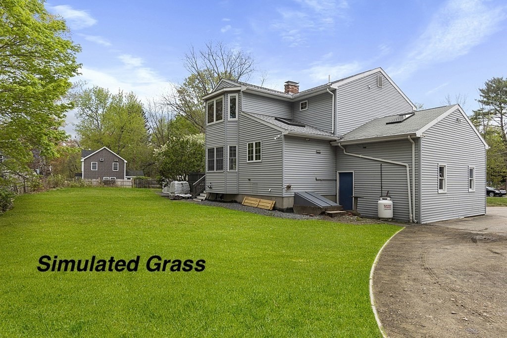 176 Southville Road Southborough, MA 01772 - Photo 36 of 39 a front view of a house with a garden