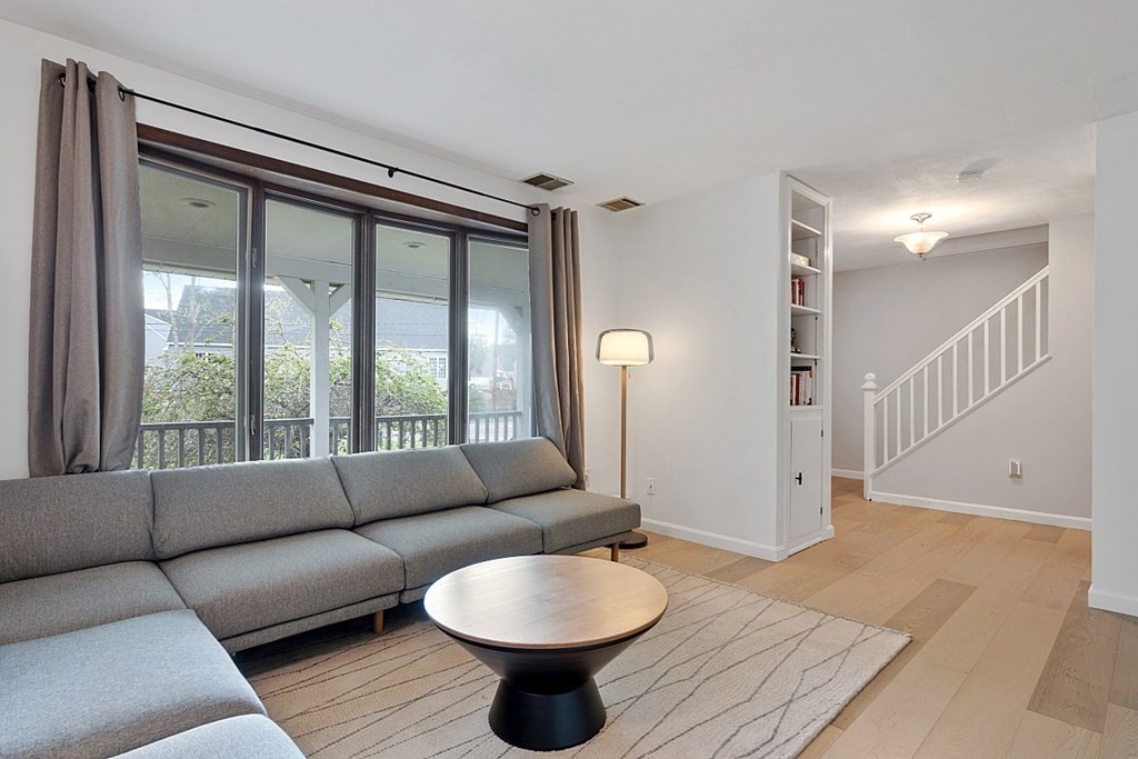 176 Southville Road Southborough, MA 01772 - Photo 5 of 39 a living room with furniture and a floor to ceiling window