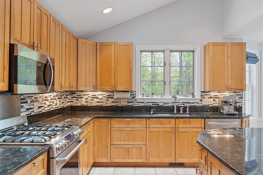 176 Southville Road Southborough, MA 01772 - Photo 7 of 39 a kitchen with stainless steel appliances granite countertop a stove a sink and a microwave