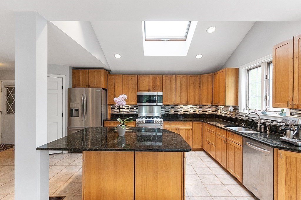 176 Southville Road Southborough, MA 01772 - Photo 8 of 39 a kitchen with granite countertop a sink and counter space