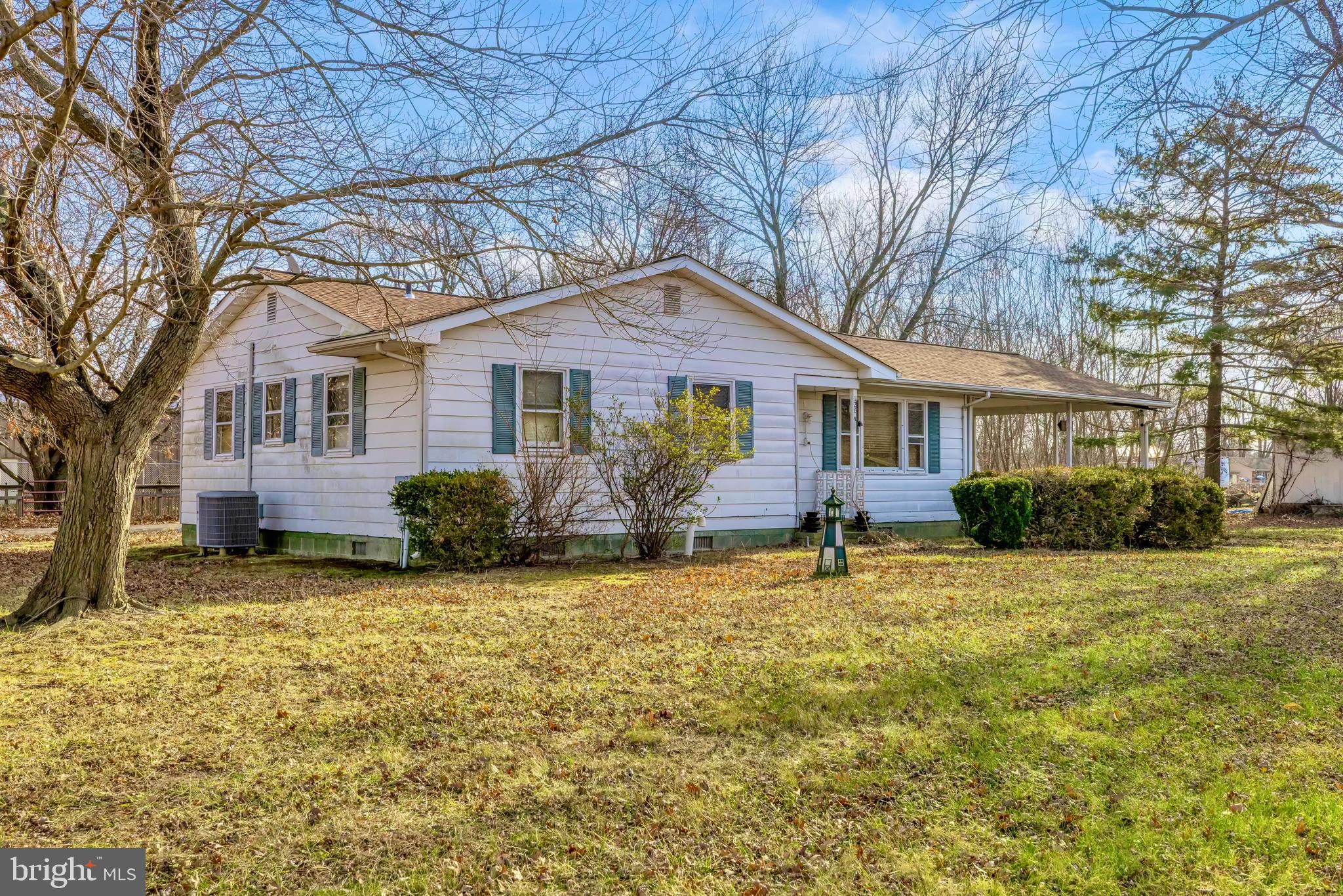 126 State Street Stevensville, MD 21666 - Photo 3 of 20 a front view of a house with garden