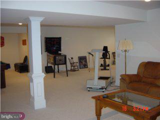 5 Hansel Road Newtown, PA 18940 - Photo 6 of 6 a living room with furniture and a flat screen tv