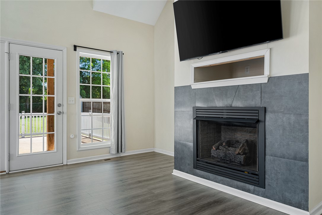 225 Streams Way Anderson, SC 29625 - Photo 14 of 50 The Great Room features a cozy fireplace and abundant natural light.
