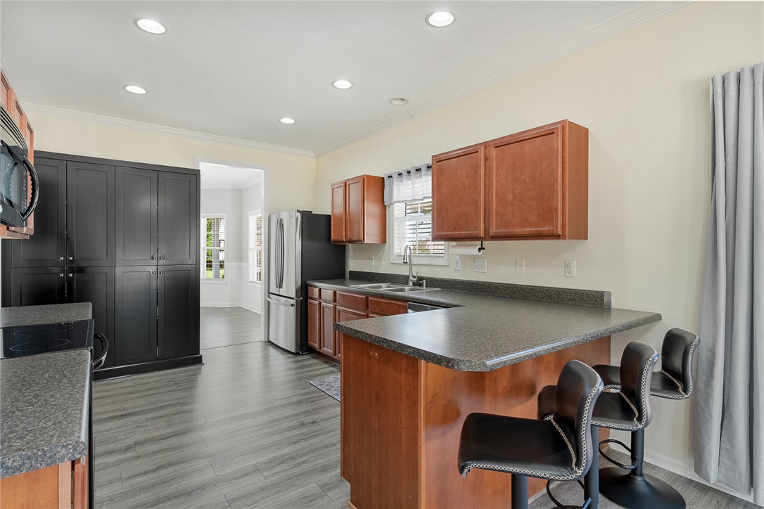 225 Streams Way Anderson, SC 29625 - Photo 17 of 50 This spacious kitchen offers ample cabinetry, modern appliances, and a convenient breakfast bar.