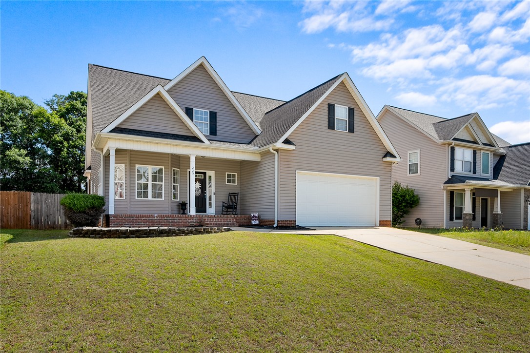 225 Streams Way Anderson, SC 29625 - Photo 2 of 50 This inviting residence features a well-maintained lawn and a welcoming front porch.