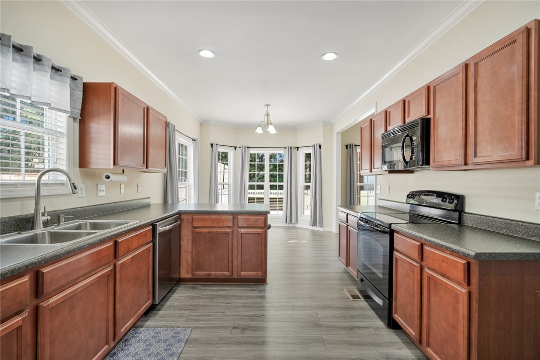 225 Streams Way Anderson, SC 29625 - Photo 20 of 50 This kitchen offers modern appliances and ample cabinetry, ideal for culinary pursuits and casual dining.