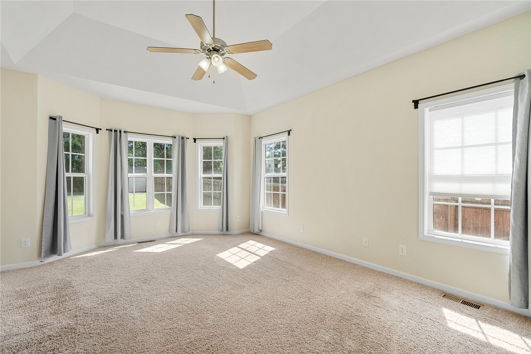 225 Streams Way Anderson, SC 29625 - Photo 23 of 50 This spacious primary suite features natural light and a tray ceiling.