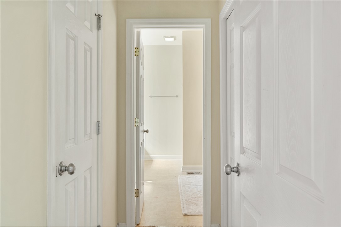 225 Streams Way Anderson, SC 29625 - Photo 26 of 50 This pathway from the primary bedroom to the spacious bathroom includes the walk-in closet and the paneled closet, offering plenty of storage!