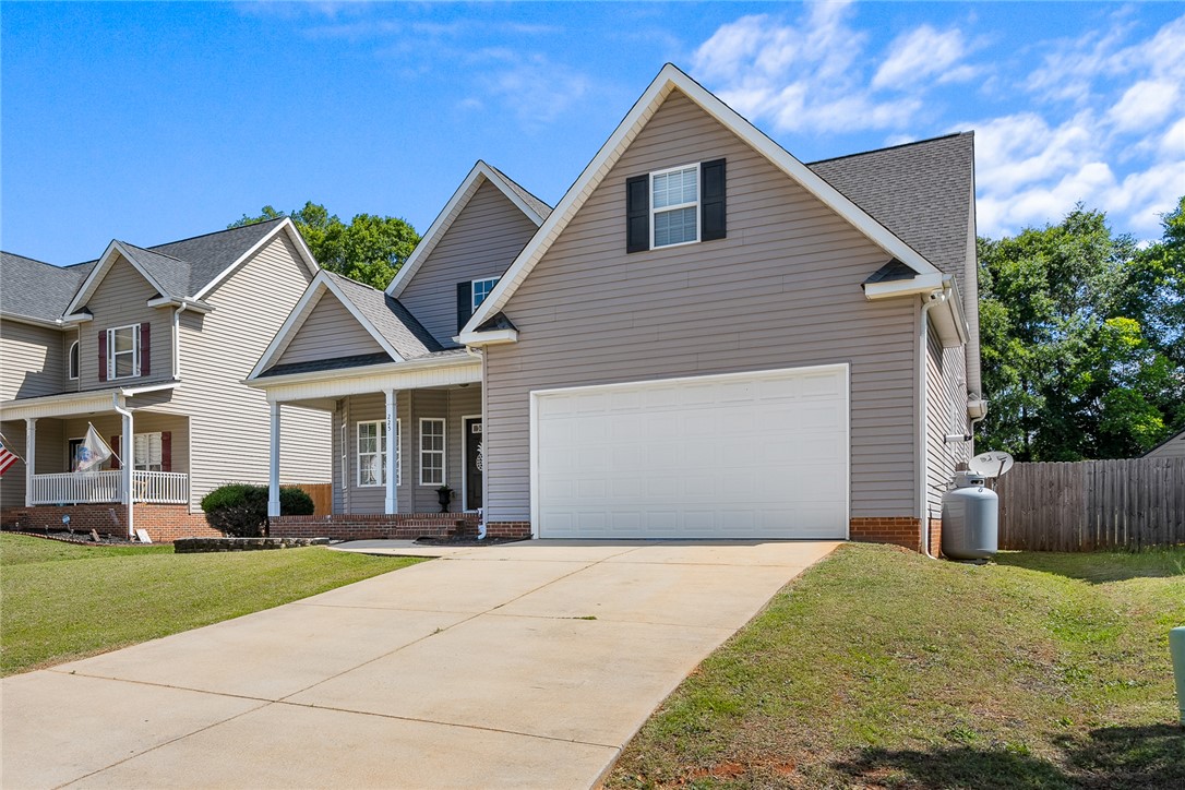 225 Streams Way Anderson, SC 29625 - Photo 3 of 50 This home includes a spotless attached garage and fenced backyard.