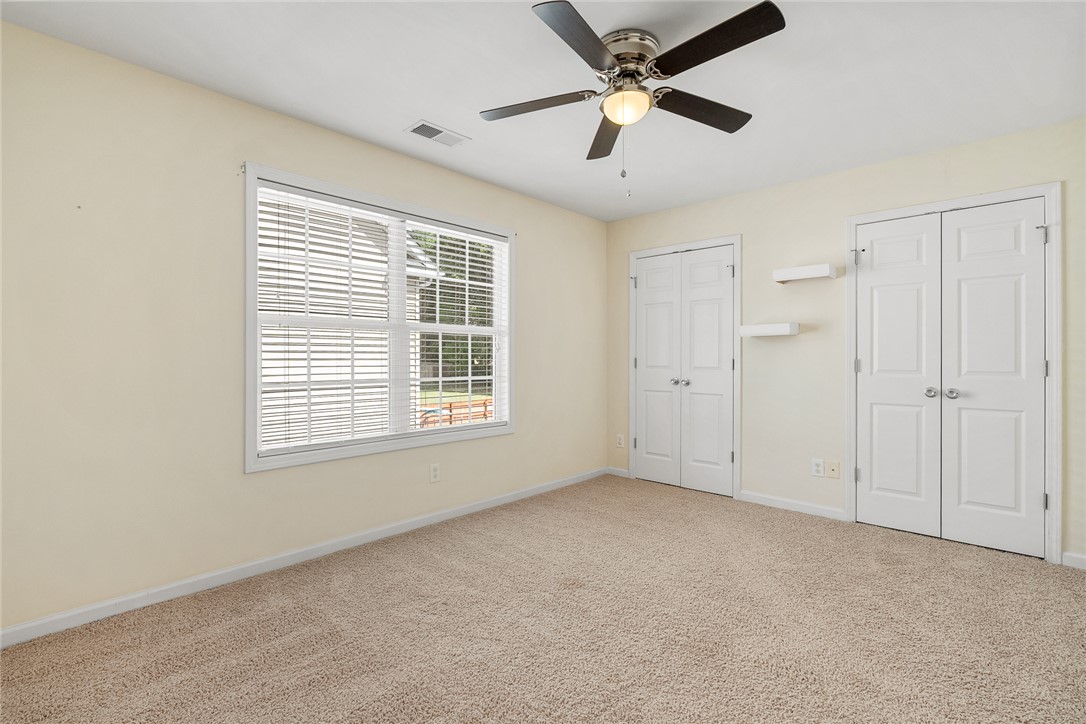 225 Streams Way Anderson, SC 29625 - Photo 33 of 50 This second floor bedroom offers plenty of closet space and shelving.